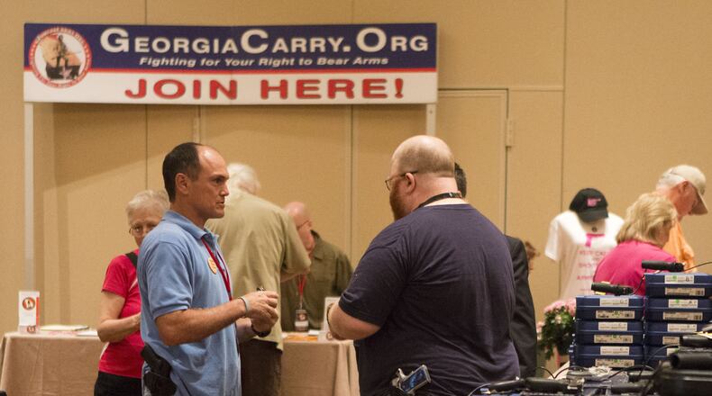 Second Amendment supporters attended the 6th Annual GeorgiaCarry.org convention in Atlanta in 2014. (Photo by Phil Skinner / For the AJC)