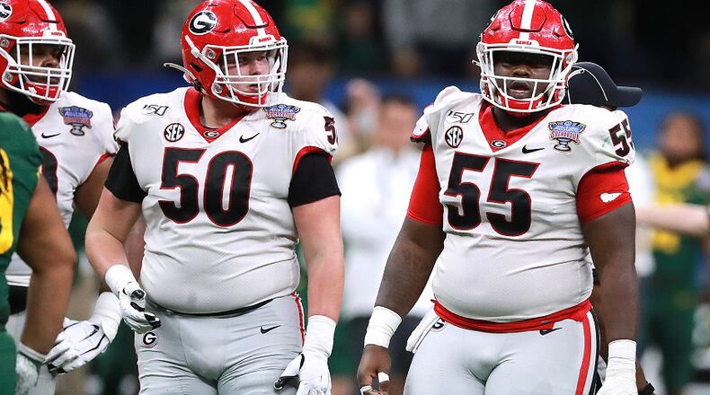 Georgia offensive lineman Warren Ericson (50) and Trey Hill (55) work against Baylor in the Sugar Bowl on Wednesday, January 1, 2020, in New Orleans.  Curtis Compton ccompton@ajc.com