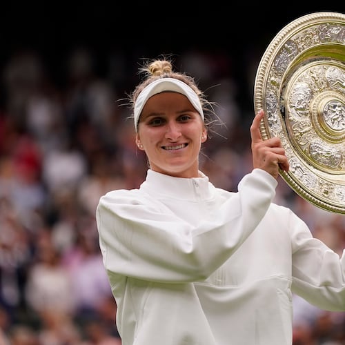 FILE - Czech Republic's Marketa Vondrousova celebrates with the trophy after beating Tunisia's Ons Jabeur to win the final of the women's singles on day thirteen of the Wimbledon tennis championships in London, Saturday, July 15, 2023. (AP Photo/Alberto Pezzali, file)