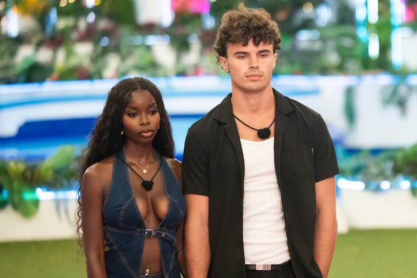 This image released by Peacock shows Olandria Carthen, left, and Nicolas "Nic" Vansteenberghe from the reality series "Love Island USA." (Ben Symons/Peacock via AP)