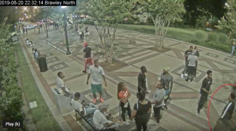 Atlanta police released video of a man wanted in connection with the Aug. 20 shooting of four college students, two from Clark Atlanta University and two from Spelman College. The suspect is circled in red. ATLANTA POLICE DEPARTMENT.