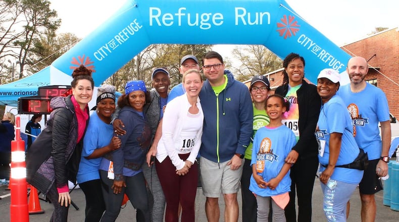 Members of Team Elavon pose for the cameras after the 2017 Refuge Run 5K and 10K hosted by City of Refuge. Proceeds from the run go toward helping pull people out of poverty. CONTRIBUTED BY TRUE SPEED PHOTOGRAPHY