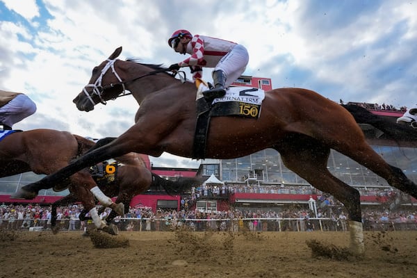Umberto Rispoli, atop Journalism, participates in the 150th running of the Preakness Stakes horse race Saturday, May 17, 2025, at Pimlico Race Course in Baltimore. (AP Photo/Stephanie Scarbrough)