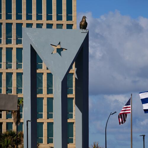 The Cuban flag flies at half-mast at the Anti-Imperialist Tribune near the U.S. embassy in Havana, Cuba, Monday, Jan. 5, 2026, in memory of Cubans who died two days before in Caracas, Venezuela during the capture of Venezuelan President Nicolas Maduro by U.S. forces. (AP Photo/Ramon Espinosa)