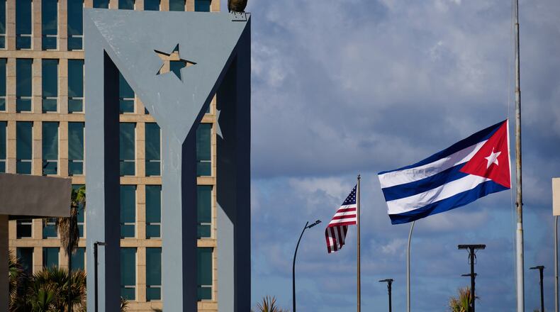 The Cuban flag flies at half-mast at the Anti-Imperialist Tribune near the U.S. embassy in Havana, Cuba, Monday, Jan. 5, 2026, in memory of Cubans who died two days before in Caracas, Venezuela during the capture of Venezuelan President Nicolas Maduro by U.S. forces. (AP Photo/Ramon Espinosa)