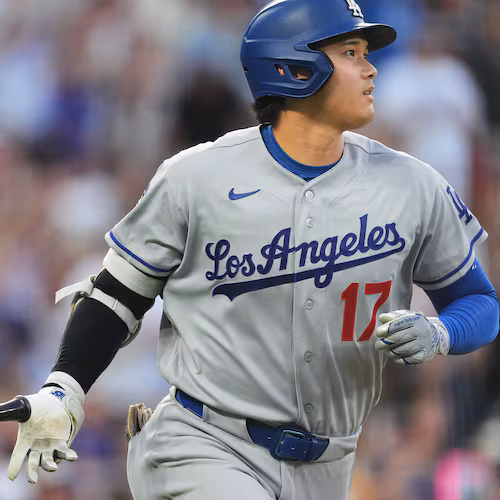Los Angeles Dodgers' Shohei Ohtani drops his bat as he heads up the first-base line after hitting a two-run home run off Colorado Rockies starting pitcher Ryan Feltner in the third inning of a baseball game Tuesday, Aug. 18, 2026, in Denver. (AP Photo/David Zalubowski)