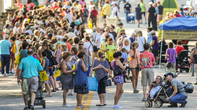 Attendees enjoy the outdoors at a spring festival in Stone Mountain.