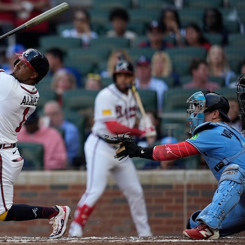Atlanta Braves second baseman Ozzie Albies (1) hits a sacrifice fly for an RBI in the first inning of a baseball game against the Toronto Blue Jays, Tuesday, June 2, 2026, in Atlanta. (AP Photo/Mike Stewart)