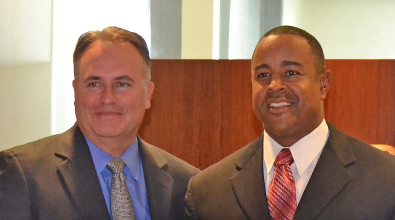 Dave Preter (left), president and CEO of Georgia's Own Credit Union, and Brian Jordan are pictured as Preter presents a donation for the Brian Jordan Foundation. Courtesy of Brian Jordan Foundation