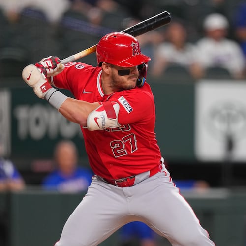 Los Angeles Angels designated hitter Mike Trout waits for a pitch from the Texas Rangers during the first inning of a baseball game, Wednesday, July 8, 2026, in Arlington, Texas. (AP Photo/Julio Cortez)