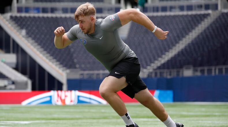 FILE - Offensive lineman Leander Wiegand, of Germany, participates in a drill at the NFL international scouting combine at Tottenham Hotspur Stadium in London, Tuesday, Oct. 4, 2022. (AP Photo/Steve Luciano, File)