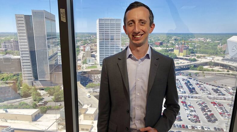 CIM Group First Vice President Devon McCorkle stands in the company’s offices overlooking downtown Atlanta’s Gulch. CIM plans a 40-acre mixed-use development over the active railroad lines and parking lots between Mercedes-Benz Stadium and the Five Points MARTA station. The company plans to call the development Centennial Yards. J. Scott Trubey/strubey@ajc.com