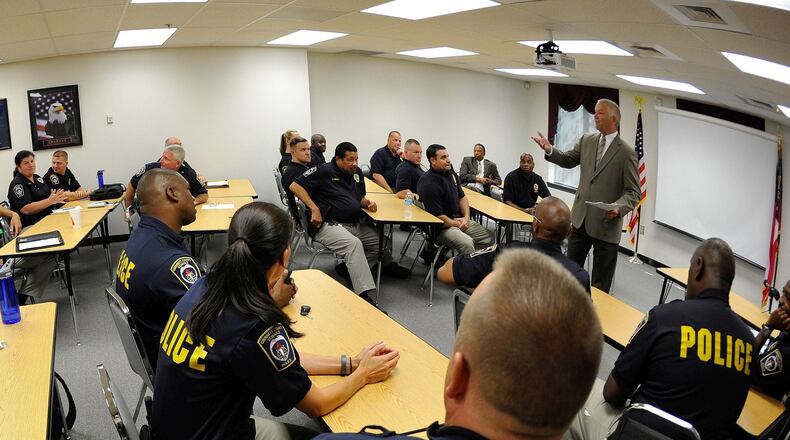 Gwinnett County school resource officers meet before the start of the 2014-15 school year. AJC FILE PHOTO
