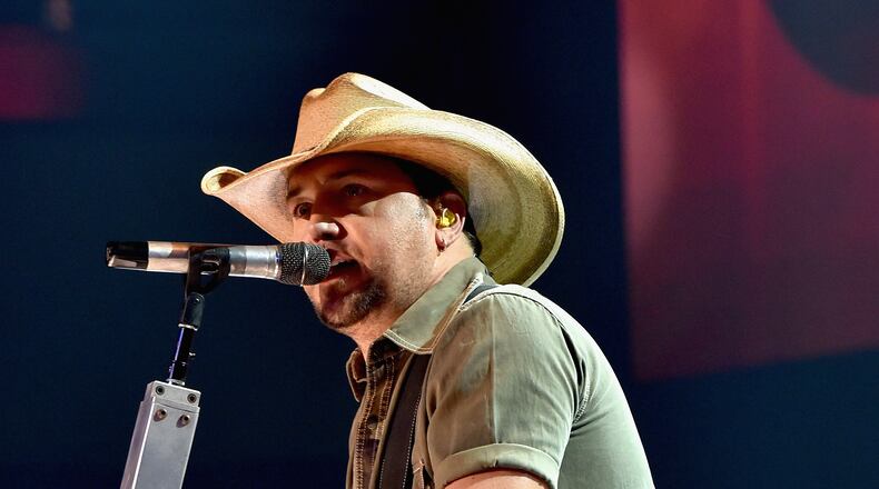 BURBANK, CA - SEPTEMBER 29: Musician Jason Aldean performs onstage during the iHeartRadio album release party with Jason Aldean at The iHeartRadio Theater Los Angeles on September 29, 2014 in Burbank, California. (Photo by Kevin Winter/Getty Images for iHeartMedia) Macon native Jason Aldean will take the stage at the CMA Awards next month. Photo: Getty Images.