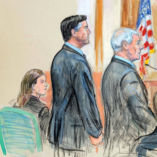This courtroom sketch depicts former FBI Director James Comey, second from left, and his attorneys Jessica Carmichael, seated left, and Patrick J. Fitzgerald, standing right, during his arraignment at the federal courthouse in Alexandria, Va., Wednesday, Oct. 8, 2025. Assistant U.S. Attorney Tyler Lemons, is seated right. (Dana Verkouteren via AP)