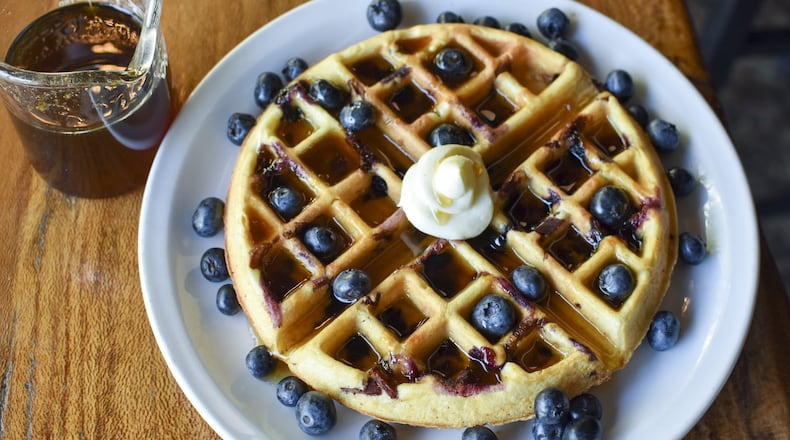 Chef Ryan Burke of Twain’s Brewpub and Billiards in Decatur makes Blueberry-Bacon Waffles with with Orange-Maple Syrup for his family. CONTRIBUTED BY HENRI HOLLIS