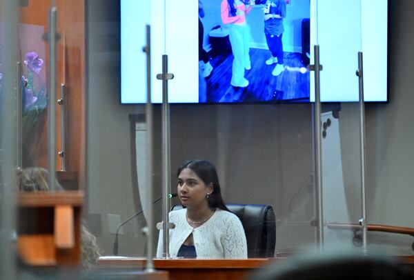 Ananya Rao, daughter of Sumanth and Anindita Rao, testifies on the witness stand during a hearing at DeKalb County Courthouse in April 2026.  (Hyosub Shin/AJC)