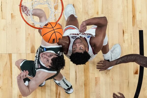 Auburn center Dylan Cardwell (44) and Michigan State center Szymon Zapala (10) during the second half in the Elite Eight of the NCAA college basketball tournament, Sunday, March 30, 2025, in Atlanta. (AP Photo/George Walker IV)