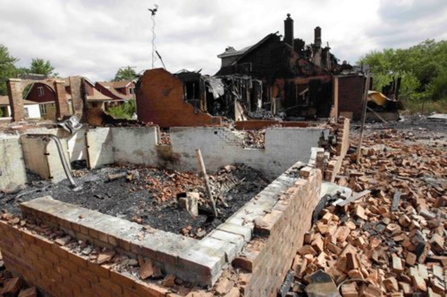 Winds push fires through dozens of Detroit homes