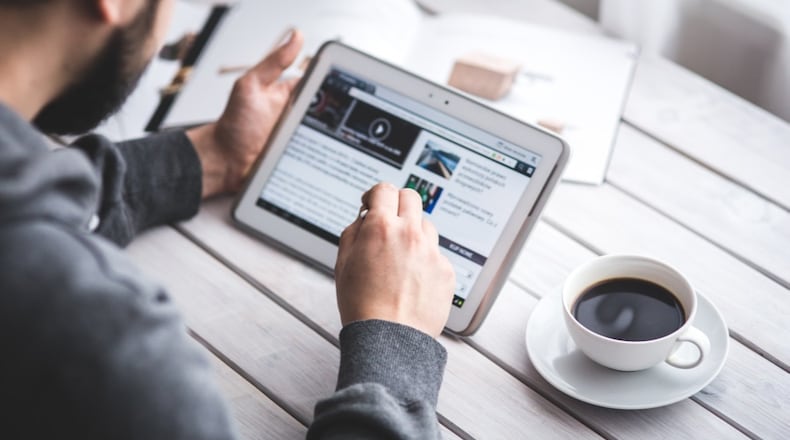 Stock photo of man using a tablet computer