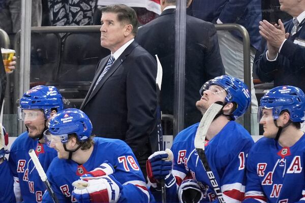 New York Rangers coach Peter Laviolette looks up during the third period of an NHL hockey game against the Tampa Bay Lightning in New York, Thursday, April 17, 2025. (AP Photo/Seth Wenig)