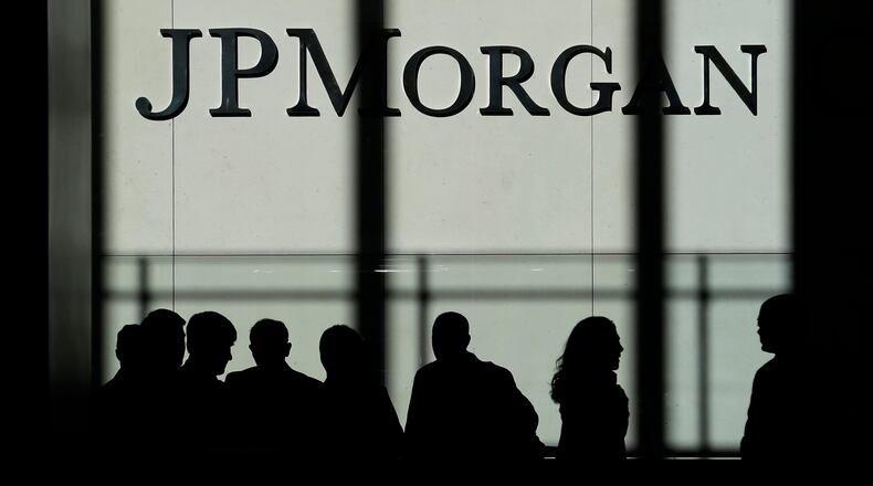 FILE - In this Monday, Oct. 21, 2013, file photo, the JPMorgan Chase & Co. logo is displayed at their headquarters in New York. (AP Photo/Seth Wenig, File)