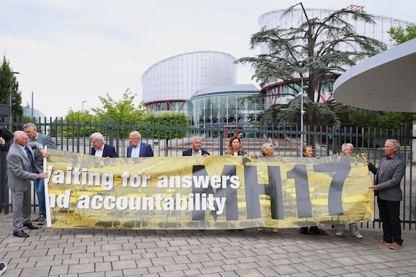 People demonstrate outside the European Court of Human Rights before it issues a landmark set of rulings about alleged Russian violations in Ukraine since 2014, including the downing of Malaysia Airlines flight MH17, Wednesday, July 9, 2025 in Strasbourg, eastern France. (AP Photo/Antonin Utz)
