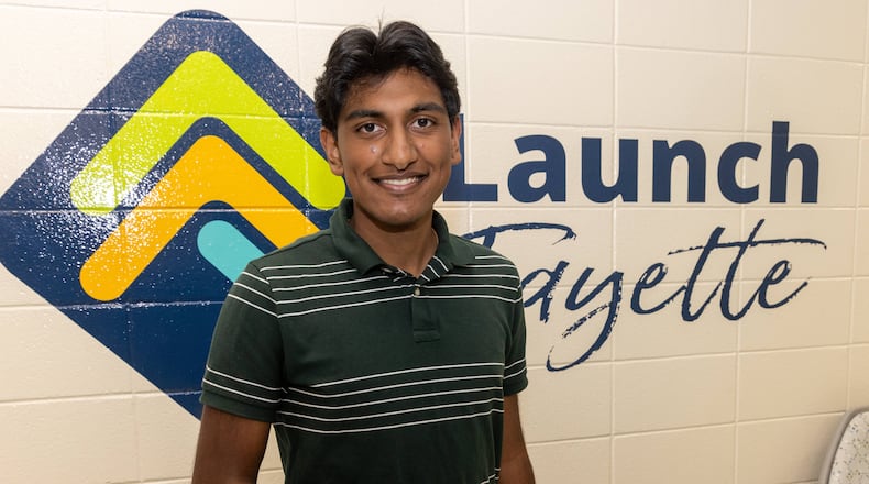 Aadi Vaidya shows a glove he developed that he believes will help reduce tremors in people with Parkinson's disease. His grandfather who lives in India has Parkinson's. PHIL SKINNER FOR THE ATLANTA JOURNAL-CONSTITUTION