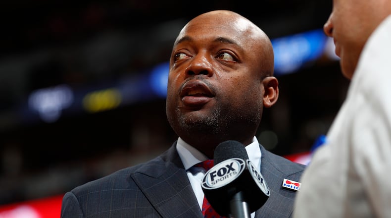 Memphis Grizzlies assistant coach Nick Van Exel conducts a TV interview during the second half Sunday, Feb. 26, 2017, in Denver. Memphis won 105-98. (David Zalubowski/AP)