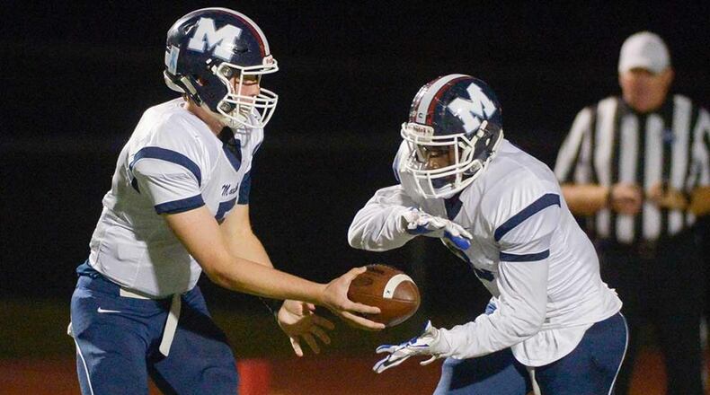 Marietta QB Harrison Bailey (5) hands off to Daniel Charles. (Daniel Varnado/Special)