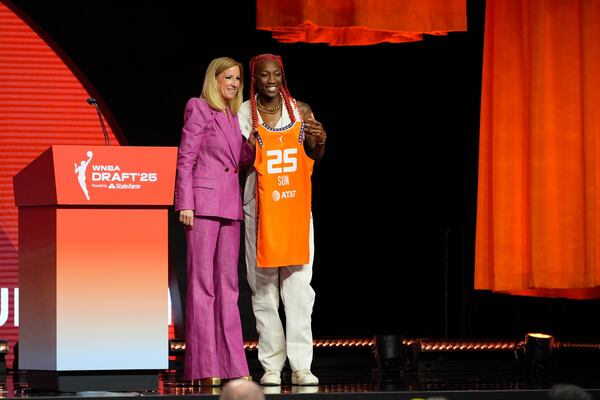North Carolina State's Saniya Rivers, right, poses with WNBA commissioner Cathy Engelbert after being selected eighth overall by the Connecticut Sun during the first round of the WNBA basketball draft, Monday, April 14, 2025, in New York. (AP Photo/Pamela Smith)