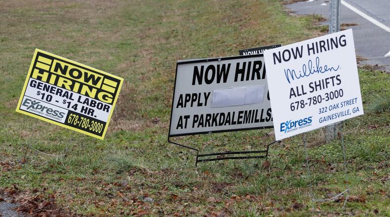 Employment signs clustered around an intersection near the soon to be closed Mount Vernon Mills in Alto, a town of about 1,500. Manufacturing jobs are changing as the economy evolves, driven by automation and a need for more higher skilled workers. Bob Andres / bandres@ajc.com