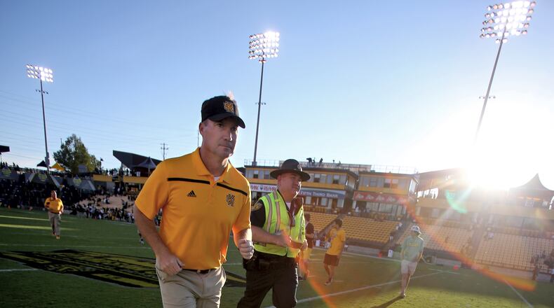 September 12, 2015 - Kennesaw, Ga: Kennesaw State University head coach Brian Bohannon runs off of the field after their game against Edward Waters at Fifth Third Bank Stadium, Saturday, September 12, 2015, in Kennesaw, Ga.. KSU won 58-7. This is the first home game of KSU's inaugural football season. PHOTO / JASON GETZ