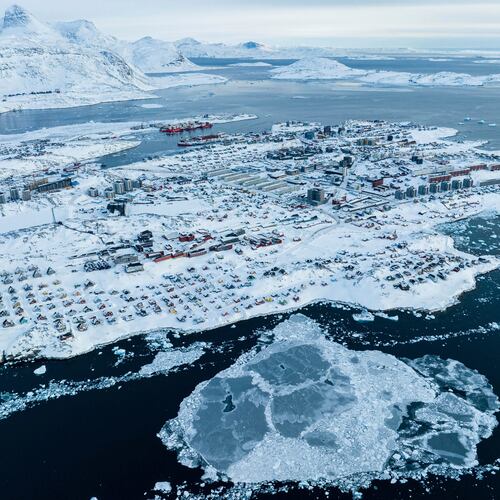 FILE - Houses covered by snow are seen on the coast of a sea inlet of Nuuk, Greenland, on March 7, 2025. (AP Photo/Evgeniy Maloletka, File)