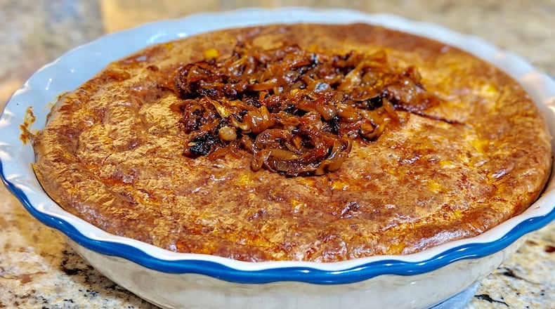 Cheesesteak Cheesecake includes bits of rib-eye steak and banana peppers, and it’s topped with onion jam. CONTRIBUTED BY PAULA PONTES