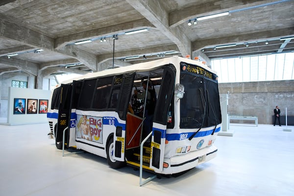 The Bus by Red Grooms is seen at the Fenix Migration Museum in Rotterdam, Netherlands, Wednesday, May 14, 2025. (AP Photo/Peter Dejong)