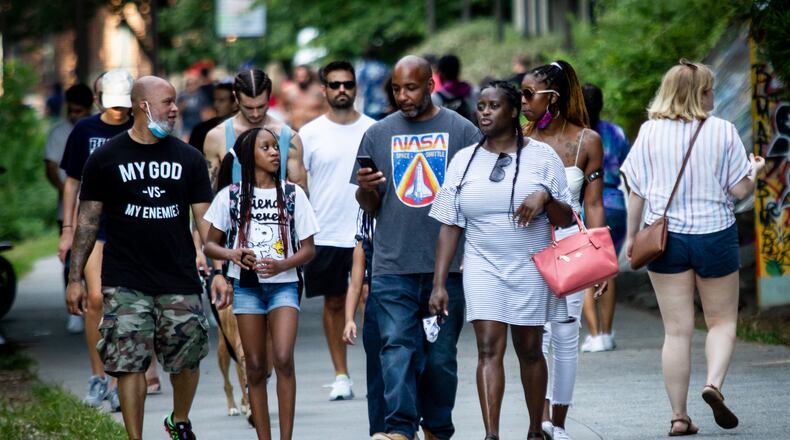 People walk along the Beltline near in September. STEVE SCHAEFER / SPECIAL TO THE AJC