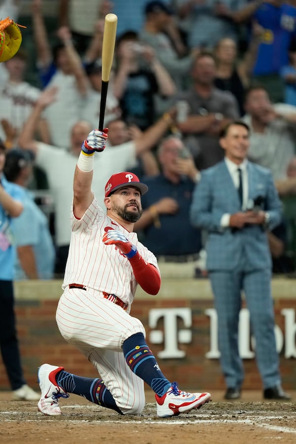 Philadelphia Phillies Kyle Schwarber celebrates after winning the tiebreaker at the MLB baseball All-Star game between the American League and National League, Tuesday, July 15, 2025, in Atlanta. (AP Photo/Brynn Anderson)
