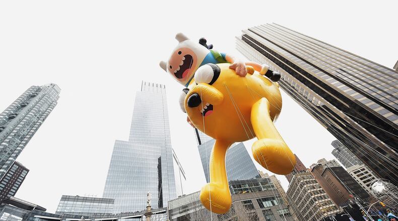 NEW YORK, NY - NOVEMBER 27: The Finn 'n Jake Adventure Time balloon passes by during the 88th annual Macy's Thanksgiving Day Parade on November 27, 2014 in New York City. The Cartoon Network show, which has a cult following of adults and children, will end in 2018. (Photo by Michael Loccisano/Getty Images)