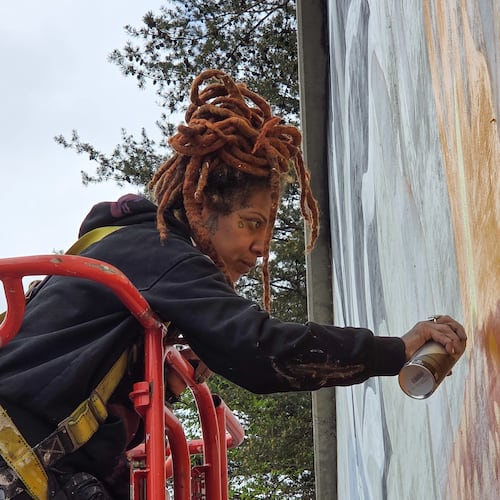 Artist Charity Hamidullah readies her mural "Wild Seed, Wild Flower" in preparation for the World Cup. (Courtesy of Arthur Rudick)