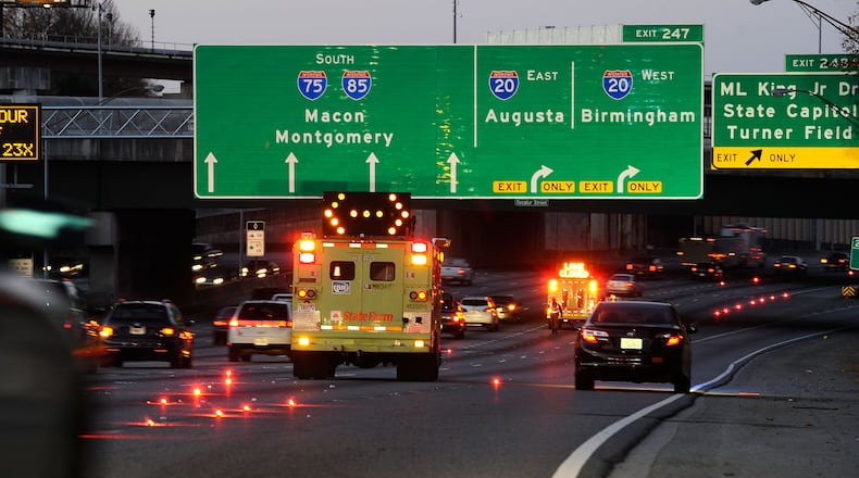HERO units direct traffic driving south on the downtown connector of I-75/85 away from the I-20 exit ramps during the morning commute because of ice on the roadway as temperatures dipped into the 20s overnight Friday, Nov. 28, 2014, in Atlanta. David Tulis/AJC Special