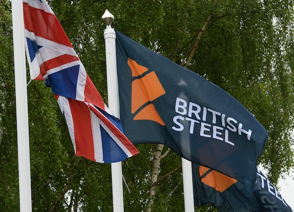 FILE - A flag with a British Steel logo at the entrance to the steelworks plant in Scunthorpe, England, June 1, 2016. (Anna Gowthorpe/PA via AP)