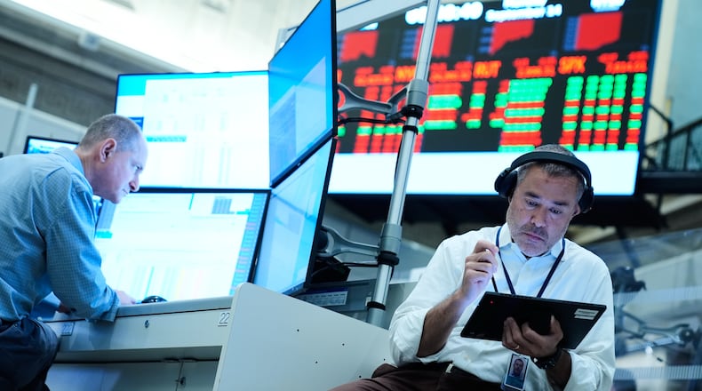 Justin Kanda works on the floor at the New York Stock Exchange in New York, Monday, Sept. 14, 2026. (AP Photo/Seth Wenig)