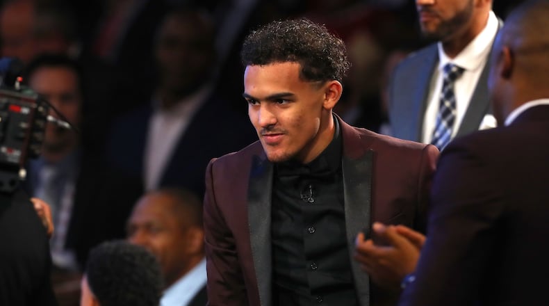 Trae Young reacts after being drafted fifth overall by the Dallas Mavericks during the 2018 NBA draft.