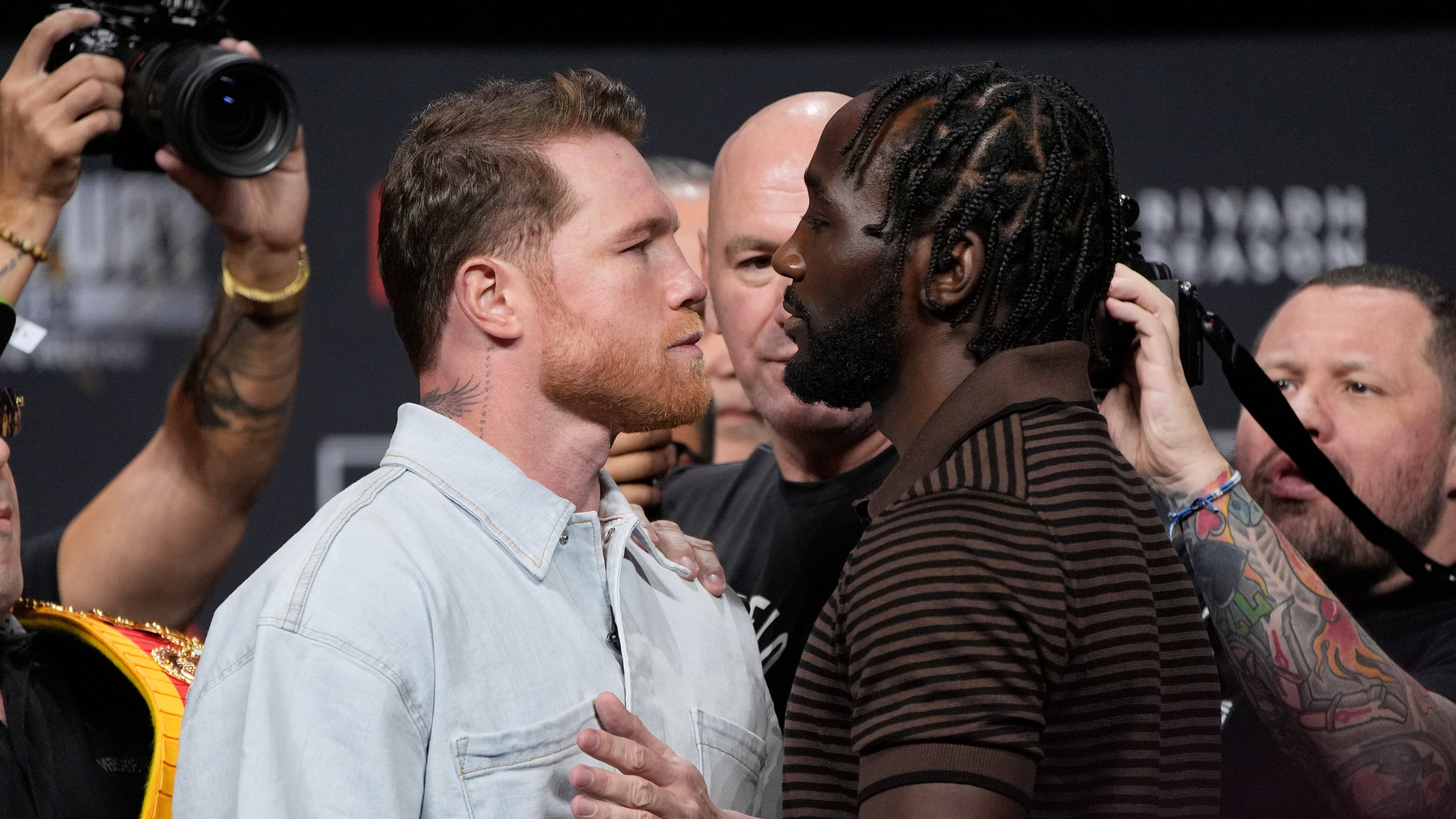 FILE - Canelo Alvarez, left, and Terence Crawford face off during a news conference for their upcoming boxing match Friday, June 27, 2025, in Las Vegas. (AP Photo/John Locher, File)