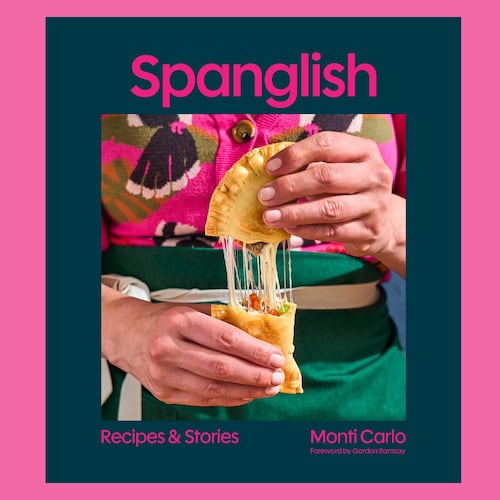 The cover of the Spanglish cookbook shows a photo of the author pulling apart a savory pastry.