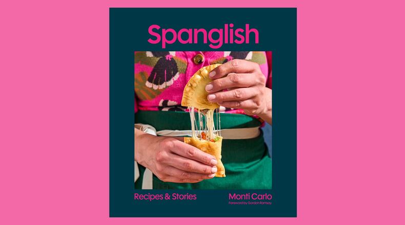 The cover of the Spanglish cookbook shows a photo of the author pulling apart a savory pastry.
