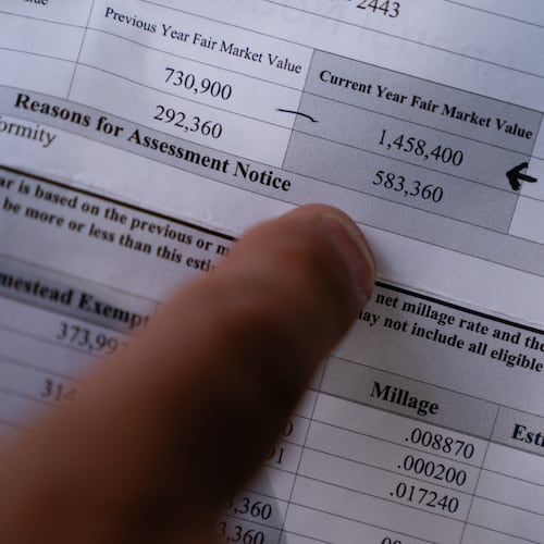 Ralph Pasquariello points at his 2023 property tax assessment on Friday, July 14, 2023, in Roswell. (Elijah Nouvelage for The Atlanta Journal-Constitution)