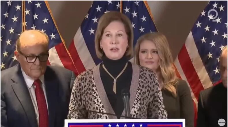 Trump attorney Sidney Powell promised to "release the kraken" of election fraud claims during a December 2020 announcement with other Trump attorneys such as Rudy Giuliani, left, and Jenna Ellis, right.