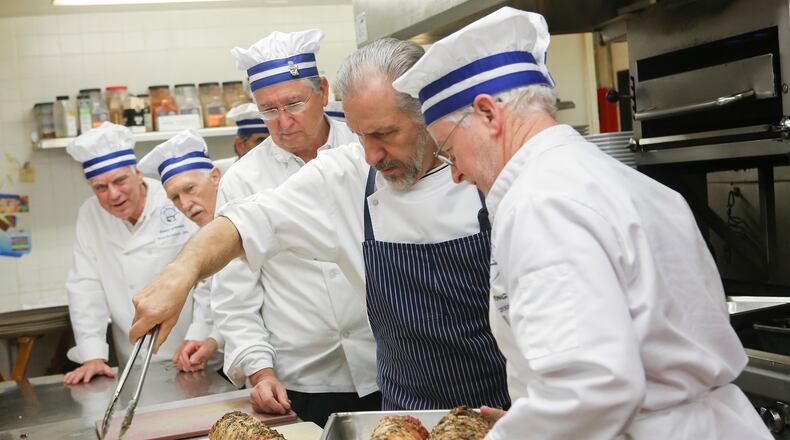 The Atlanta chapter of Les Marmitons prepares a meal in Sandy Springs.